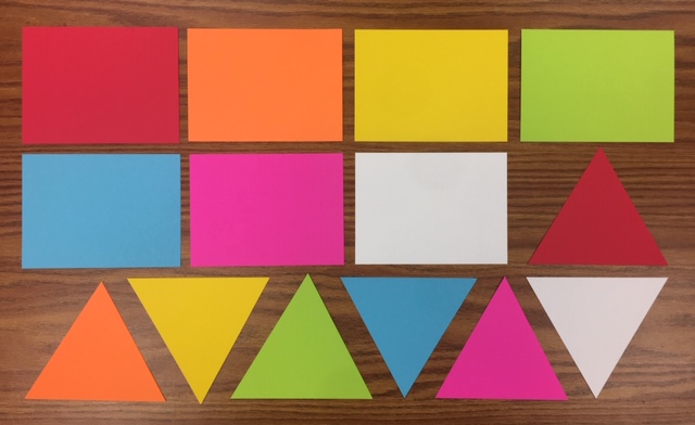 The array of differently colored and shaped cards Bronfman uses to keep track of student participation frequency.
