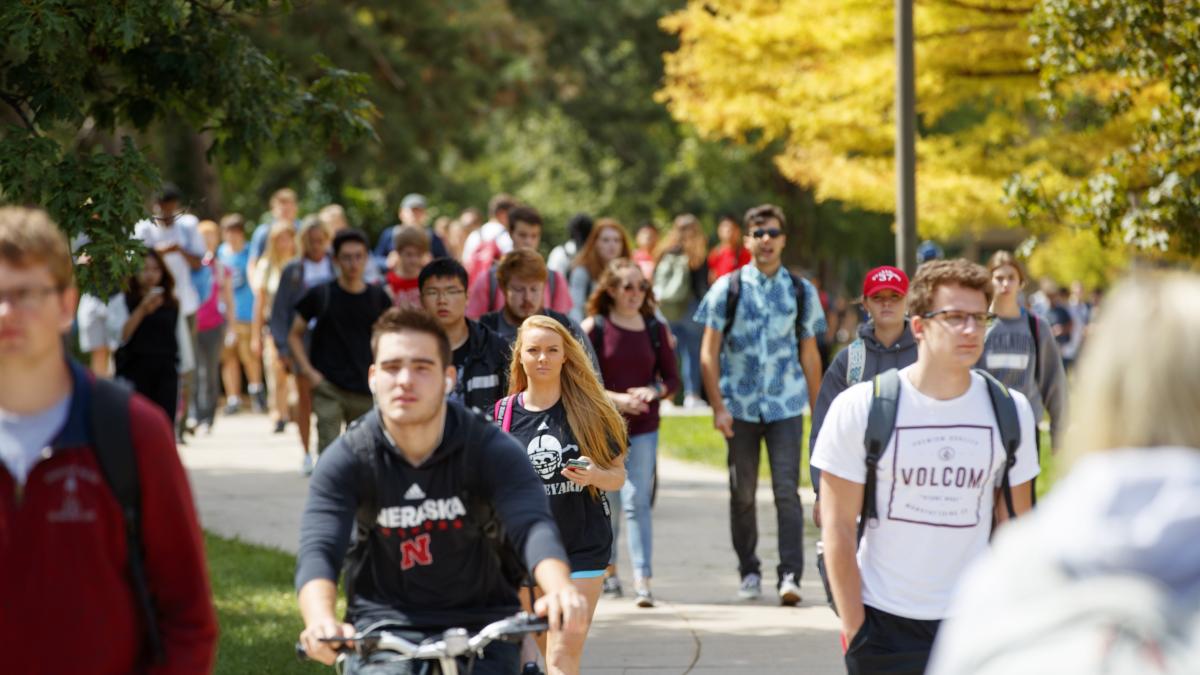 Students walk on city campus in between classes. September 5, 2017. Photo by Craig Chandler / University Communication.