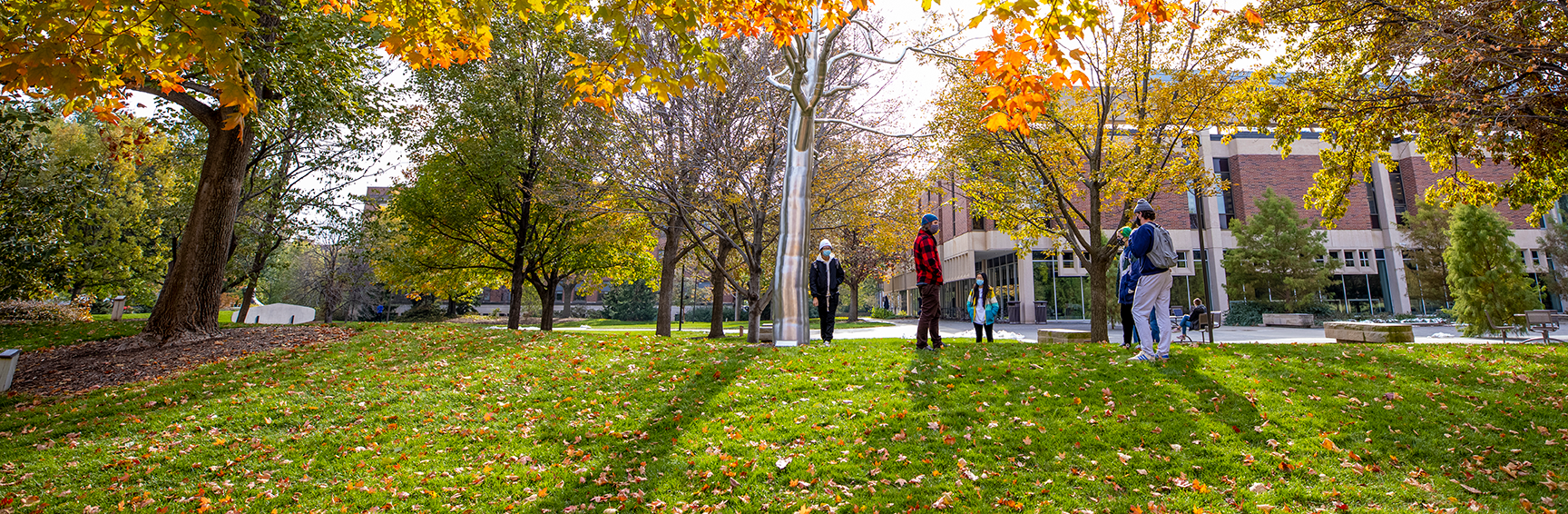 Students in class outside by the sculpture, Breach by Roxy Paine. City Campus. October 28, 2020. Photo by Craig Chandler / University Communication.