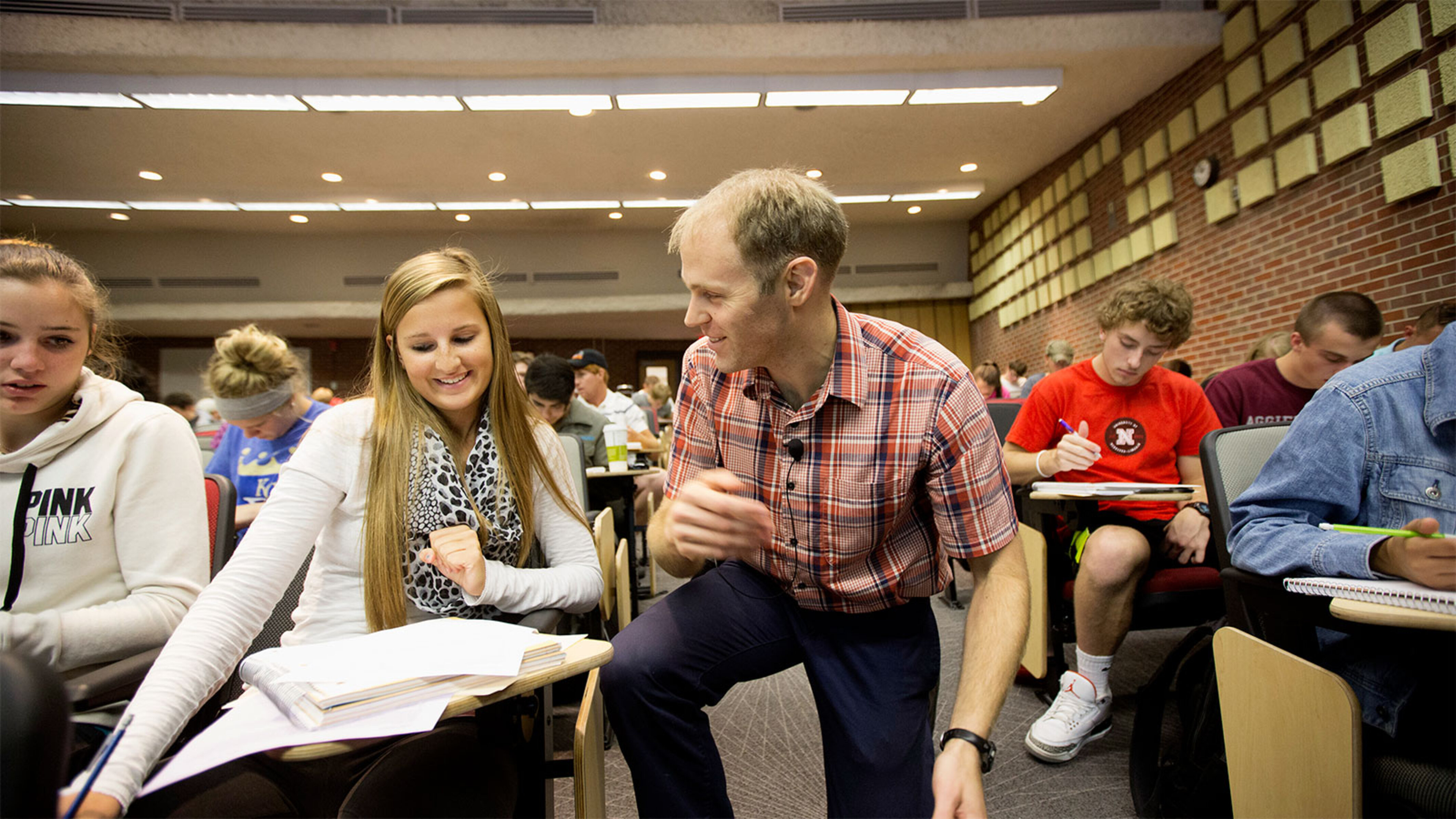 Instructor talking with student