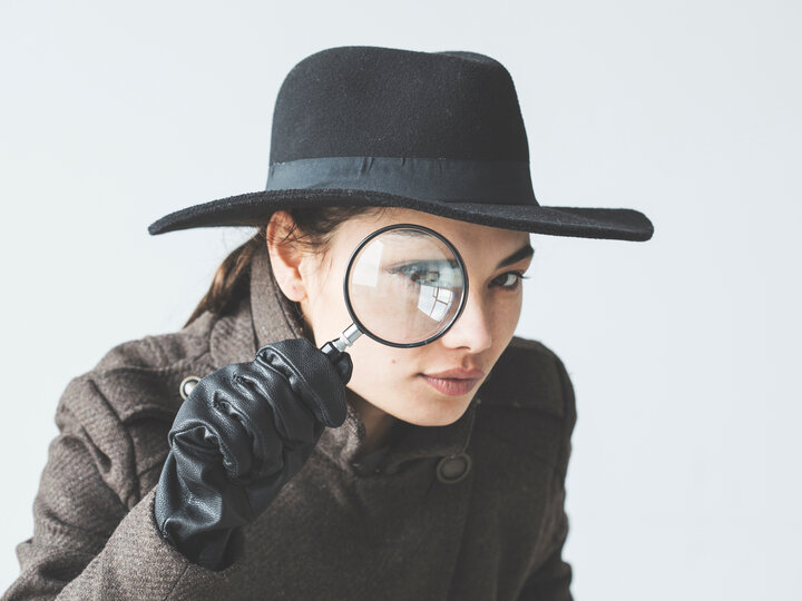 Detective with magnifying glass